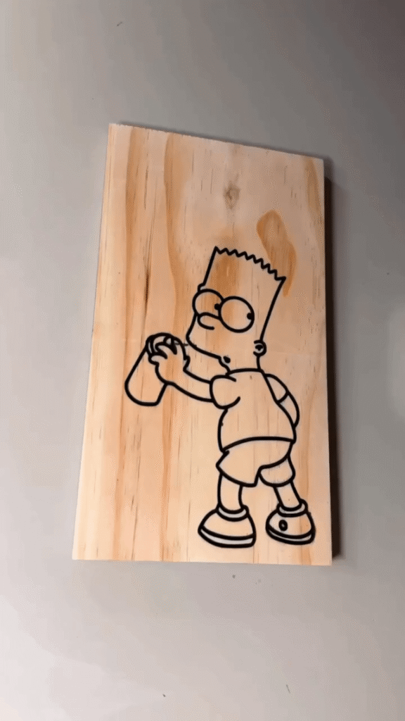 Painting Bart Simpson on a piece of wood