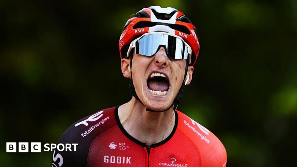 Ben Turner roars in celebration after winning the fourth stage of the Vuelta a Espana
