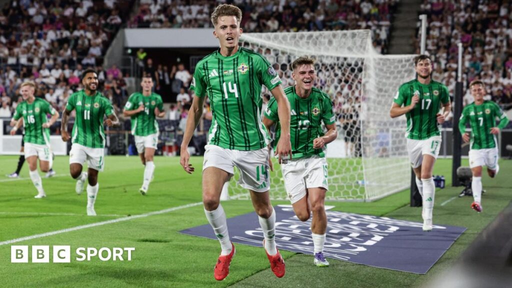 Isaac Price celebrates his goal in Germany with his Northern Ireland team-mates
