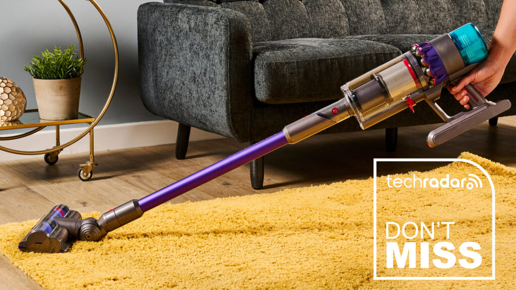 Dyson Gen5 Detect vacuum cleaner being used on a yellow rug