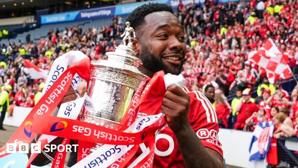 Shayden Morris holding the Scottish Cup after last season's final