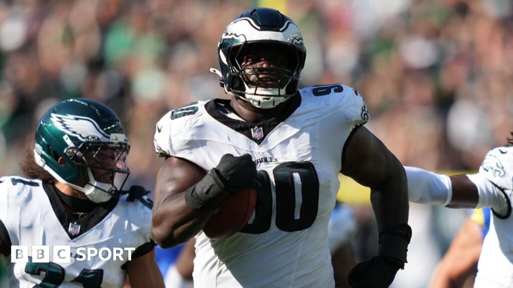 Jordan Davis of the Philadelphia Eagles runs with the ball to score a touchdown against the Los Angeles Rams