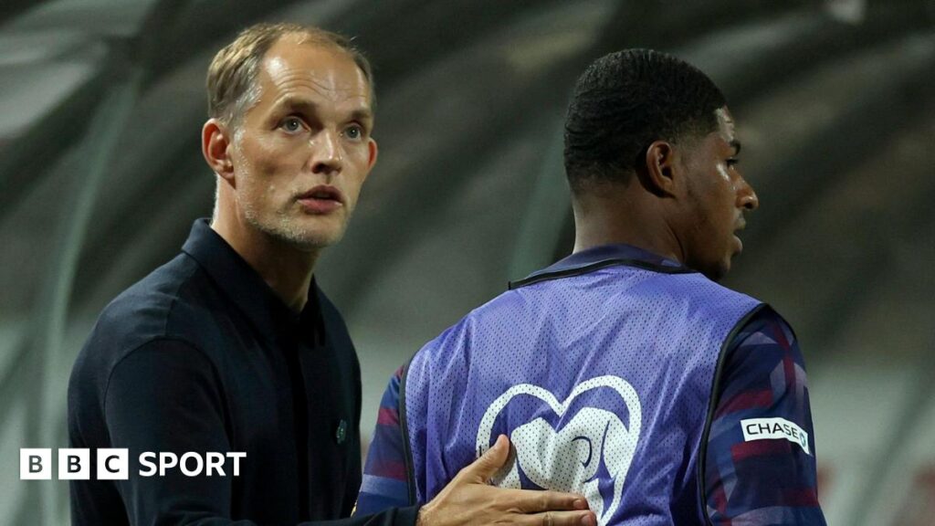 Thomas Tuchel patting Marcus Rashford on his back