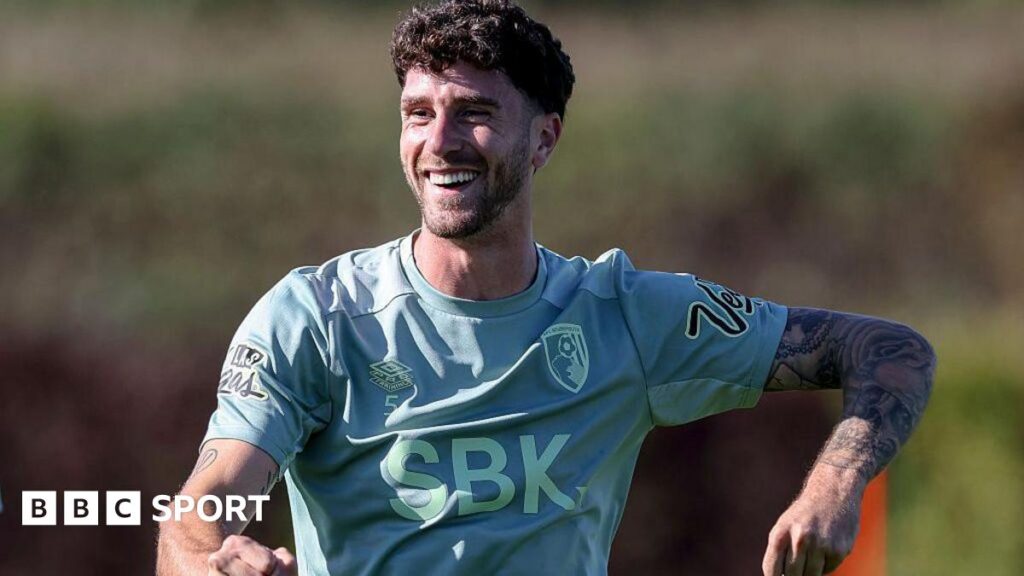 Bournemouth defender Marcos Senesi smiles during a training session