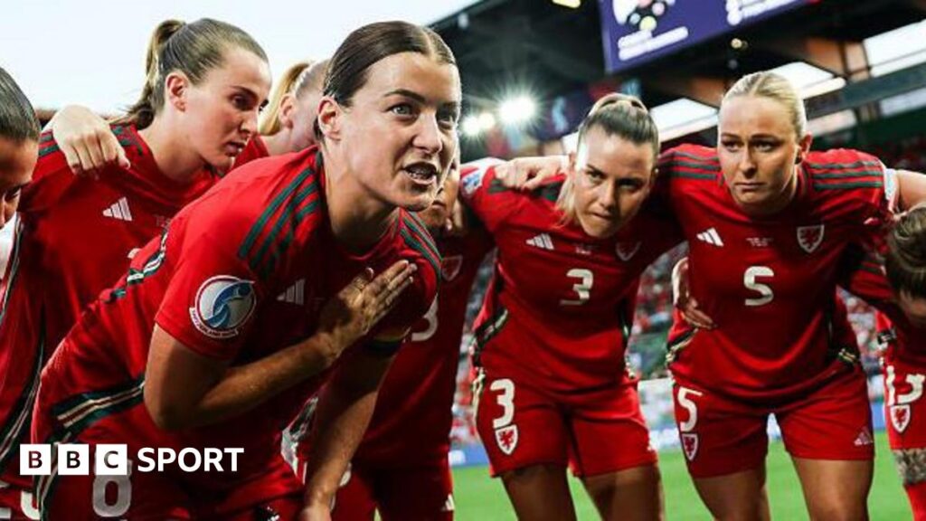 Wales captain Angharad James speaks to her team-mates (L-R: Carrie Jones, Gemma Evans, Rhiannon Roberts) prior to the Euro 2025 match against England