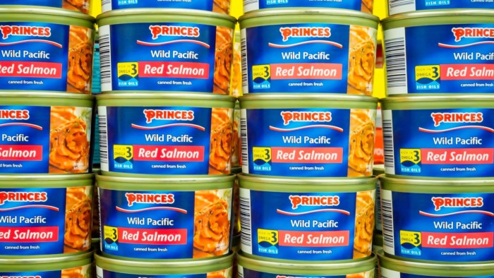 Princes London IPO meets lukewarm reception from investors Stacks of Princes Wild Pacific Red Salmon tins arranged on a supermarket shelf, labels facing outward.