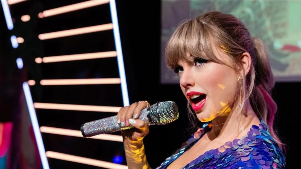 Taylor Swift pictured holding a microphone