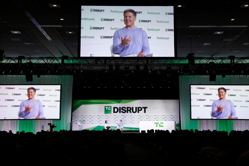 TechCrunch Disrupt 2025: How to watch Vinod Khosla, Netflix, Slate Auto, and Startup Battlefield Editor-in-Chief & GM of TechCrunch, and Roelof Botha speak onstage during day one of TechCrunch Disrupt 2025 at Moscone Center on October 27, 2025 in San Francisco
