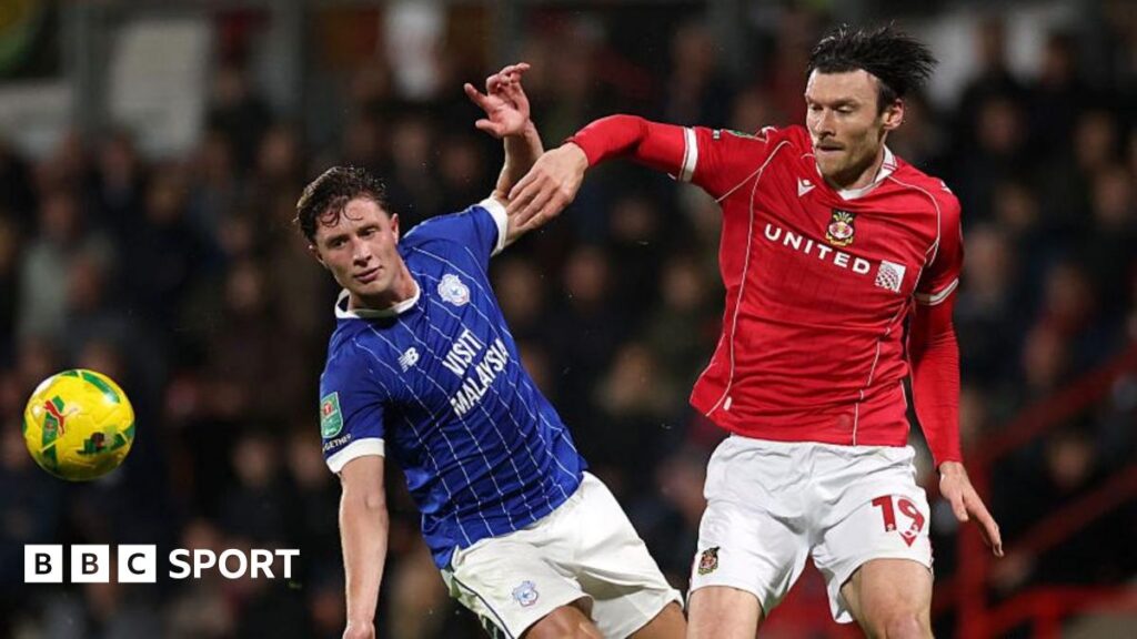 Wrexham v Cardiff City talking points: Happy phone calls and defensive concerns Cardiff City defender Will Fish (L) battles with Wrexham striker Kieffer Moore (R)