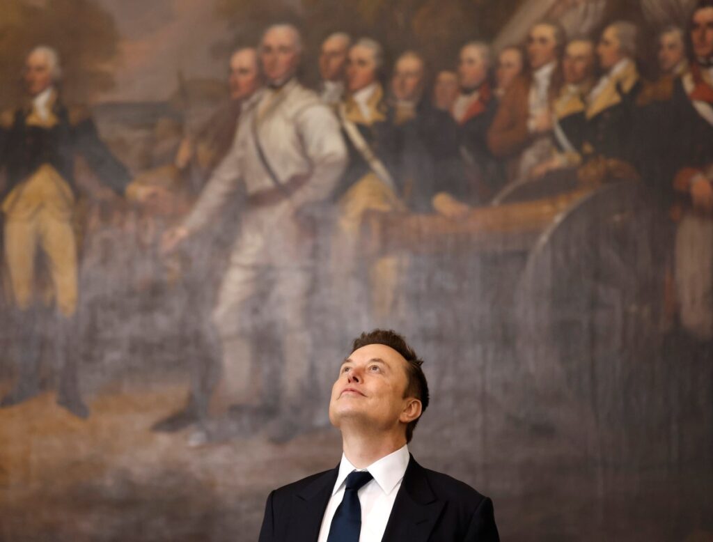 a photo of Elon Musk looking up at the ceiling while standing in front of a historical painting
