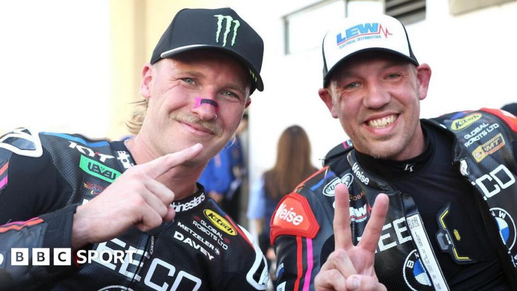 Macau Grand Prix: Davey Todd romps to dominant win over Peter Hickman Davey Todd and Peter Hickman make hand gestures while posing for a photo