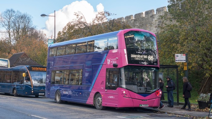 UK probes whether buses made in China can be turned off from afar A purple and pink electric double-decker bus operated by First Bus, serving route 66 to the University of York, at a city bus stop.