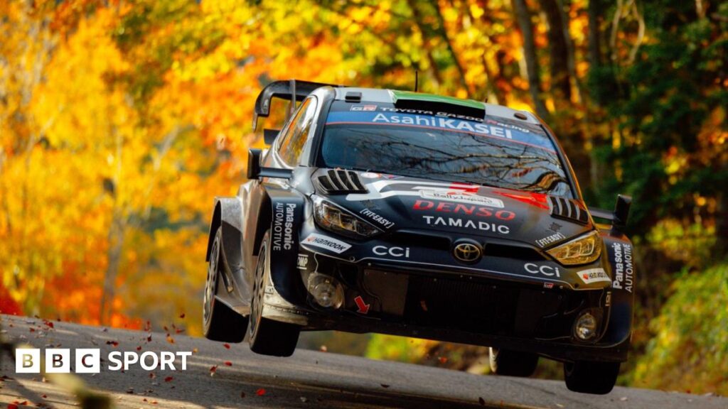 WRC: Rally Japan winner Sebastien Ogier cuts Elfyn Evans’ lead before Saudi Arabia finale The black Toyota GR Rally1 car of Elfyn Evans above the road surface with a backdrop of golden-leaved trees at Rally Japan