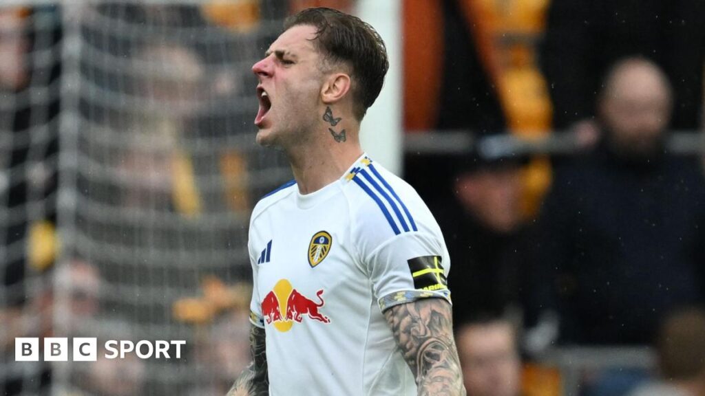 Wearing a white Leeds United shirt, Joe Rodon shouts