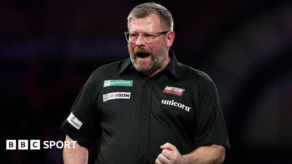 James Wade celebrates