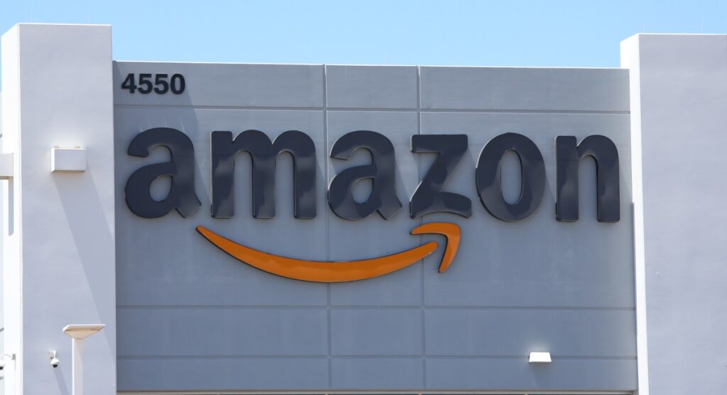 Amazon agrees to pay consumers $309M in returns policy settlement Amazon logo on building